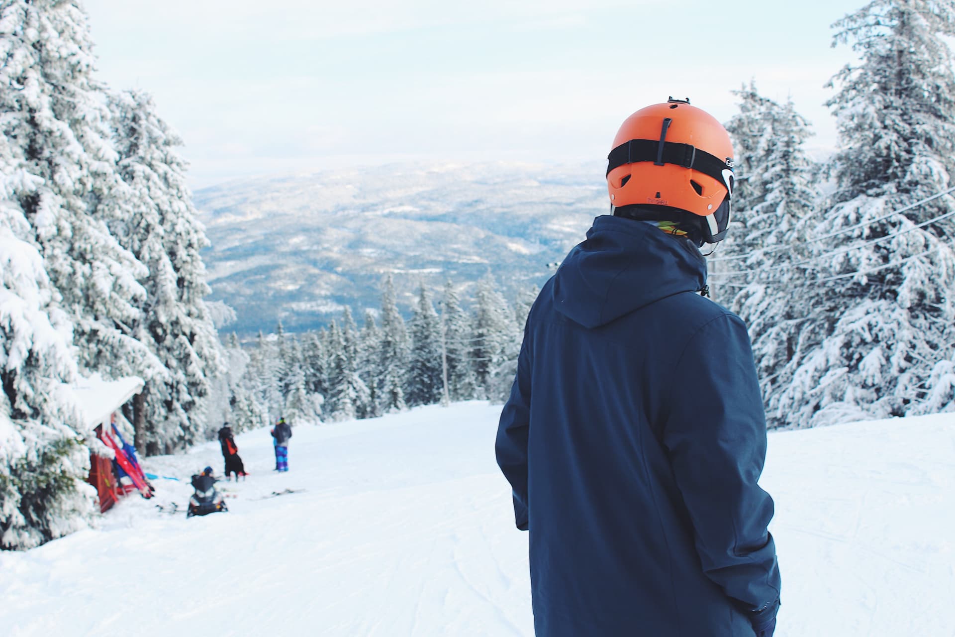 Boarder admiring snowy ski slope